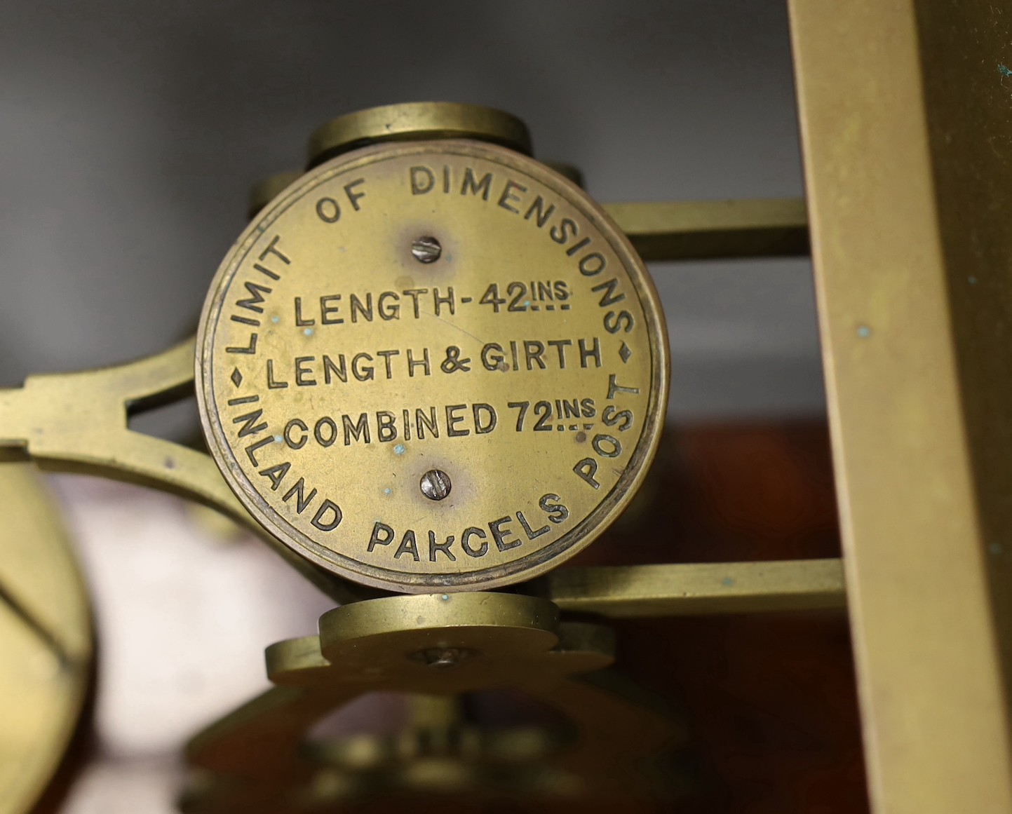 Victorian brass postal scales by S. Mordan & Co. of London, on a mahogany plinth, 45cm wide